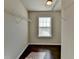 Walk-in closet with dark hardwood floors and shelving at 2329 Village Grove Dr, Suwanee, GA 30024