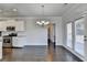 Dining room with hardwood floors and patio access at 2329 Village Grove Dr, Suwanee, GA 30024