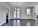 Dining area with hardwood floors and chandelier at 2329 Village Grove Dr, Suwanee, GA 30024