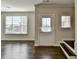 Bright foyer with hardwood floors, white door and large windows at 2329 Village Grove Dr, Suwanee, GA 30024