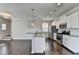 Modern kitchen with granite countertops, stainless steel appliances, and white cabinets at 2329 Village Grove Dr, Suwanee, GA 30024