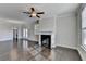 Living room with hardwood floors and fireplace at 2329 Village Grove Dr, Suwanee, GA 30024