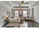 Bright main bedroom featuring hardwood floors and large windows at 2329 Village Grove Dr, Suwanee, GA 30024