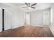 Main bedroom with hardwood floors, ceiling fan and private bathroom access at 2649 Porter Dr, Lawrenceville, GA 30044