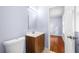 Simple bathroom with brown vanity and a toilet at 2666 Frontier Trl, Atlanta, GA 30341