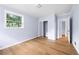 Spacious bedroom with wood flooring and mirrored closet at 2666 Frontier Trl, Atlanta, GA 30341