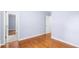 Hardwood floor bedroom with access to bathroom and hallway at 2666 Frontier Trl, Atlanta, GA 30341