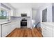 Modern kitchen with white cabinets and stainless steel appliances at 2666 Frontier Trl, Atlanta, GA 30341