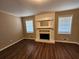 Living room with hardwood floors, fireplace, and large windows at 4427 Sun Valley Blvd, Atlanta, GA 30344