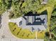 A high-angle shot of a modern home with a gray roof and well-maintained lawn, set among lush trees at 464 Pine Tree Ne Dr, Atlanta, GA 30305