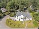 White house with gray roof, landscaping, and a paved driveway at 464 Pine Tree Ne Dr, Atlanta, GA 30305