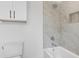 Bathroom features a shower, bathtub, and white cabinets at 464 Pine Tree Ne Dr, Atlanta, GA 30305