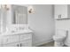 Modern bathroom with white cabinets, quartz countertop, and toilet at 464 Pine Tree Ne Dr, Atlanta, GA 30305