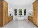 Elegant bathroom with double vanities, a soaking tub, and wood cabinets at 464 Pine Tree Ne Dr, Atlanta, GA 30305