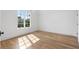 Bright bedroom with hardwood floors and large window offering natural light at 464 Pine Tree Ne Dr, Atlanta, GA 30305