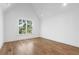 Bright bedroom with hardwood floors and vaulted ceiling at 464 Pine Tree Ne Dr, Atlanta, GA 30305