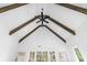 High ceiling with exposed wooden beams and a ceiling fan at 464 Pine Tree Ne Dr, Atlanta, GA 30305