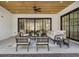 Modern covered patio with comfortable seating and a stone floor at 464 Pine Tree Ne Dr, Atlanta, GA 30305