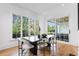 Modern dining room with dark wood table and access to backyard at 464 Pine Tree Ne Dr, Atlanta, GA 30305