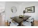 Bright dining area with a dark wood table and statement art at 464 Pine Tree Ne Dr, Atlanta, GA 30305