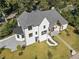 Aerial view of a home with a gray roof, manicured lawn, and modern landscaping, showcasing luxury living at 464 Pine Tree Ne Dr, Atlanta, GA 30305