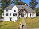 A stunning home featuring stone accents, professionally landscaped yard, and inviting walkway at 464 Pine Tree Ne Dr, Atlanta, GA 30305