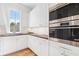 Well-appointed kitchen with dark countertops and double ovens at 464 Pine Tree Ne Dr, Atlanta, GA 30305