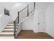 Elegant staircase with modern metal railing and hardwood steps at 464 Pine Tree Ne Dr, Atlanta, GA 30305