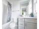 Modern bathroom with gray vanity and hexagon floor tile at 136 Ansley St, Decatur, GA 30030