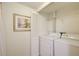 Bright laundry room with washer, dryer, and shelving at 199 14Th St # 409, Atlanta, GA 30309