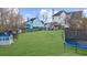 Large backyard with trampoline, playhouse, and plenty of grass space at 4450 Fairfax Dr, Cumming, GA 30028