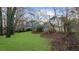 Landscaped backyard offering a large grassy area at 4450 Fairfax Dr, Cumming, GA 30028