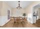 Dining room with hardwood floors and farmhouse style table and chairs at 4450 Fairfax Dr, Cumming, GA 30028