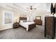 Main bedroom with carpeted floors, ceiling fan, and large windows at 4450 Fairfax Dr, Cumming, GA 30028