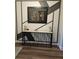 Modern entryway console table with unique metal detailing and artwork at 532 Barlow Pl, Grayson, GA 30017