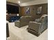 Home theater with large screen, comfortable seating, and dark walls at 532 Barlow Pl, Grayson, GA 30017