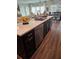 Kitchen island with seating, sink, and dishwasher; opens to Gathering room at 532 Barlow Pl, Grayson, GA 30017