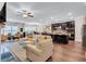 Open-concept living room flowing into kitchen with spacious layout and hardwood floors at 532 Barlow Pl, Grayson, GA 30017