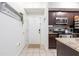 Kitchen and entryway with modern dark cabinets at 955 Juniper St Ne # 4022, Atlanta, GA 30309