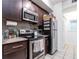 Well-equipped kitchen with dark wood cabinets at 955 Juniper St Ne # 4022, Atlanta, GA 30309