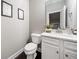 Small bathroom with white vanity and toilet at 132 Marietta Walk Trce, Marietta, GA 30064