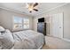 Spacious bedroom with a ceiling fan and large windows at 132 Marietta Walk Trce, Marietta, GA 30064