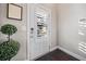 White interior door with wood flooring and plant at 132 Marietta Walk Trce, Marietta, GA 30064