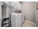 Convenient laundry room with washer, dryer, and overhead cabinets at 132 Marietta Walk Trce, Marietta, GA 30064