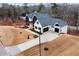 Two-story modern farmhouse with a large backyard and a three-car garage at 208 Pindos Sw Pl, Powder Springs, GA 30127