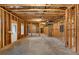 Unfinished basement with exposed framing and concrete floor at 208 Pindos Sw Pl, Powder Springs, GA 30127