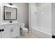 Clean bathroom with white subway tile and a built-in bathtub at 208 Pindos Sw Pl, Powder Springs, GA 30127