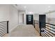 Spacious hallway with carpeted floor and modern railing at 208 Pindos Sw Pl, Powder Springs, GA 30127