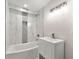 Basement bathroom with a white vanity and marble-tiled shower/tub combo at 2212 Glendale Dr, Decatur, GA 30032