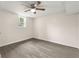 Spacious basement bedroom with wood-look flooring and a ceiling fan at 2212 Glendale Dr, Decatur, GA 30032